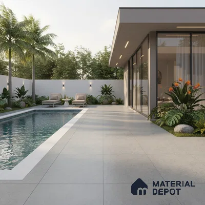 Modern outdoor space with large format grey stone tiles and poolside landscaping