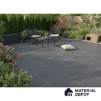 Modern outdoor patio with charcoal grey stone-look floor tiles and minimalist garden furniture