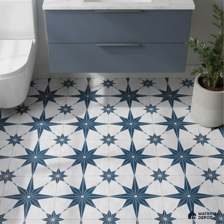 Modern bathroom with blue geometric patterned floor tiles and matte blue vanity