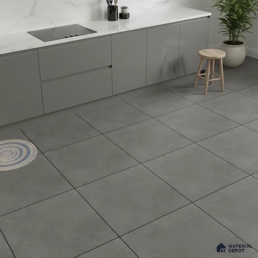 Minimalist kitchen with grey matte laminate cabinets, white marble-look quartz countertop, and large grey stone floor tiles
