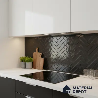 Modern kitchen with white quartz countertop, matte black cabinets, and glossy black herringbone subway tile backsplash