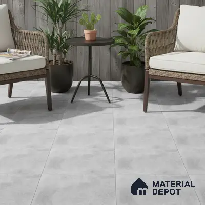 Scandinavian outdoor seating with grey stone-look floor tiles and weathered wood wall panels