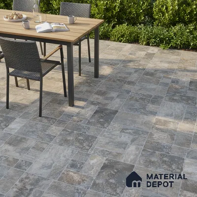 Modern outdoor patio with stone-look patterned floor tiles and wooden dining table