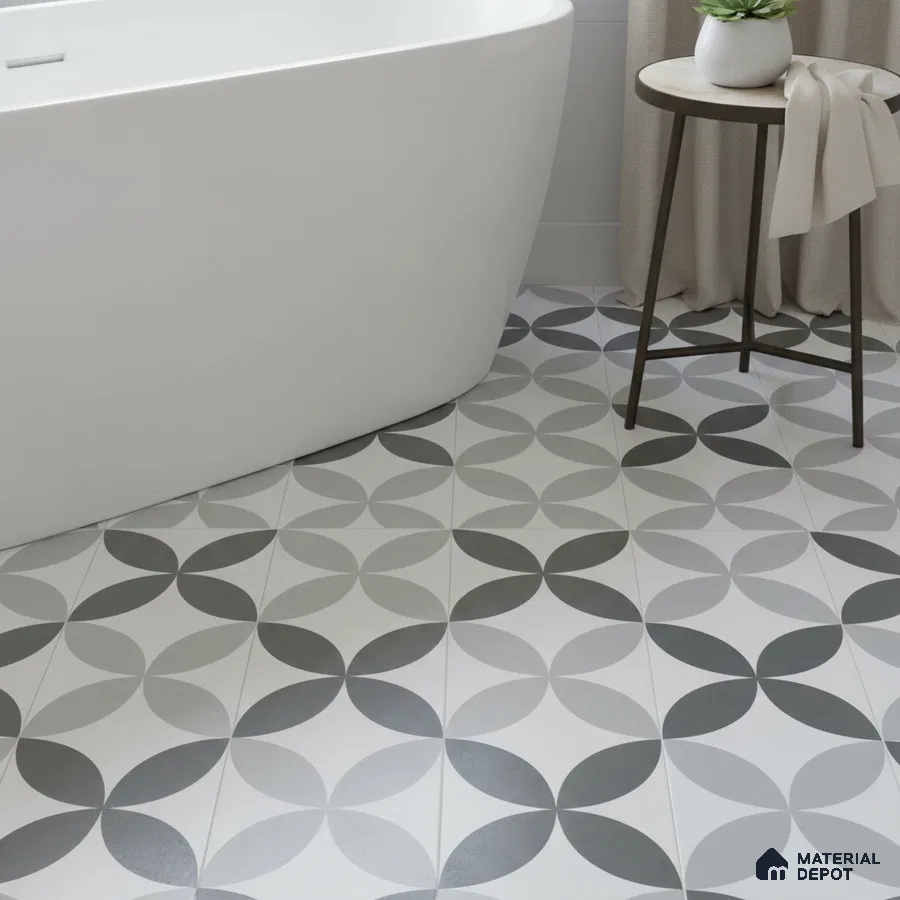 Modern bathroom with geometric black-and-grey patterned floor tiles and freestanding tub