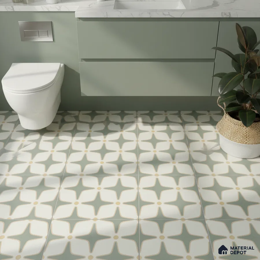 Modern bathroom with sage green laminate vanity and geometric patterned floor tiles