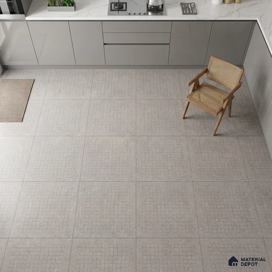 Minimalist kitchen with grey matte laminate cabinets, white marble-look quartz countertop, and patterned light grey floor tiles