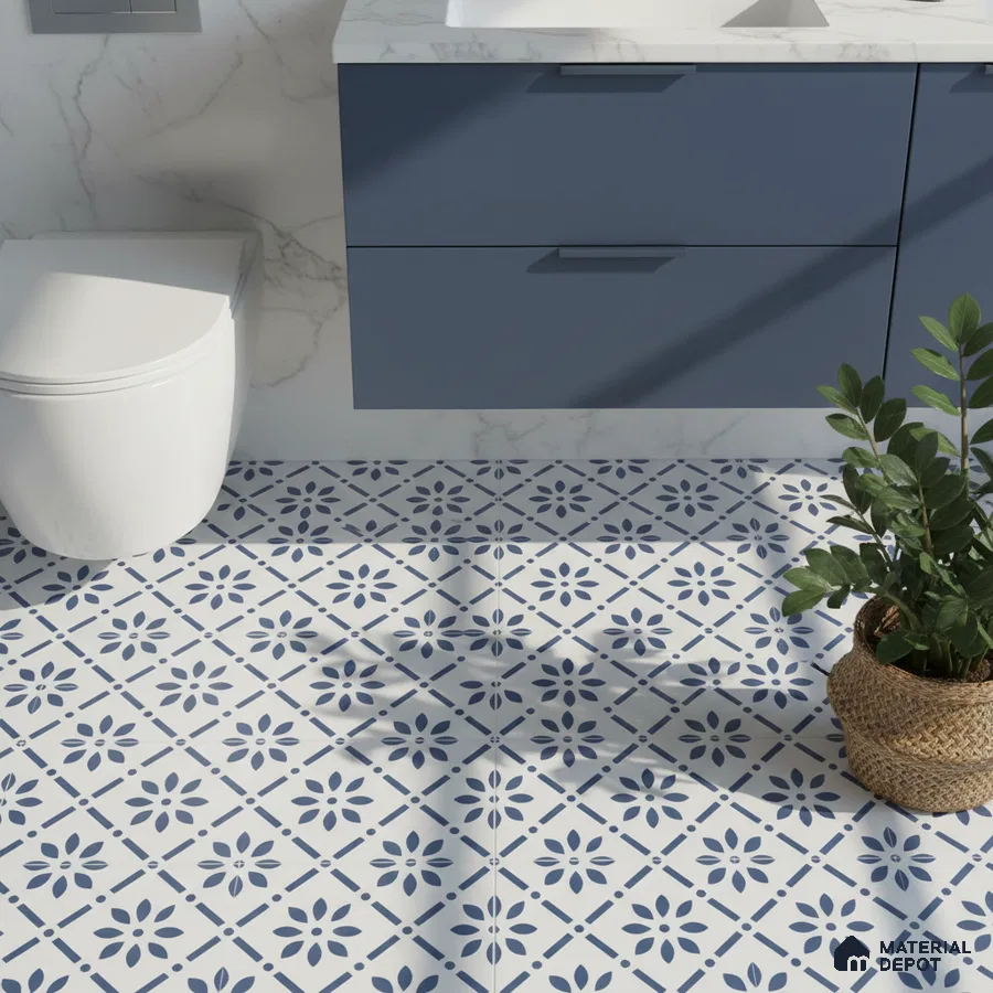 Modern bathroom with blue vanity, marble wall, and blue-and-white floral patterned floor tiles