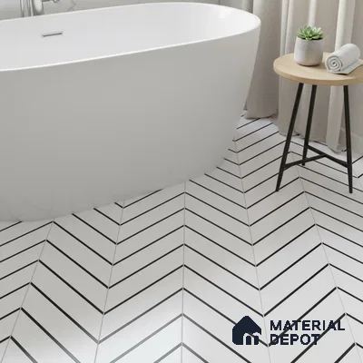 Minimalist bathroom with white chevron floor tiles and freestanding tub