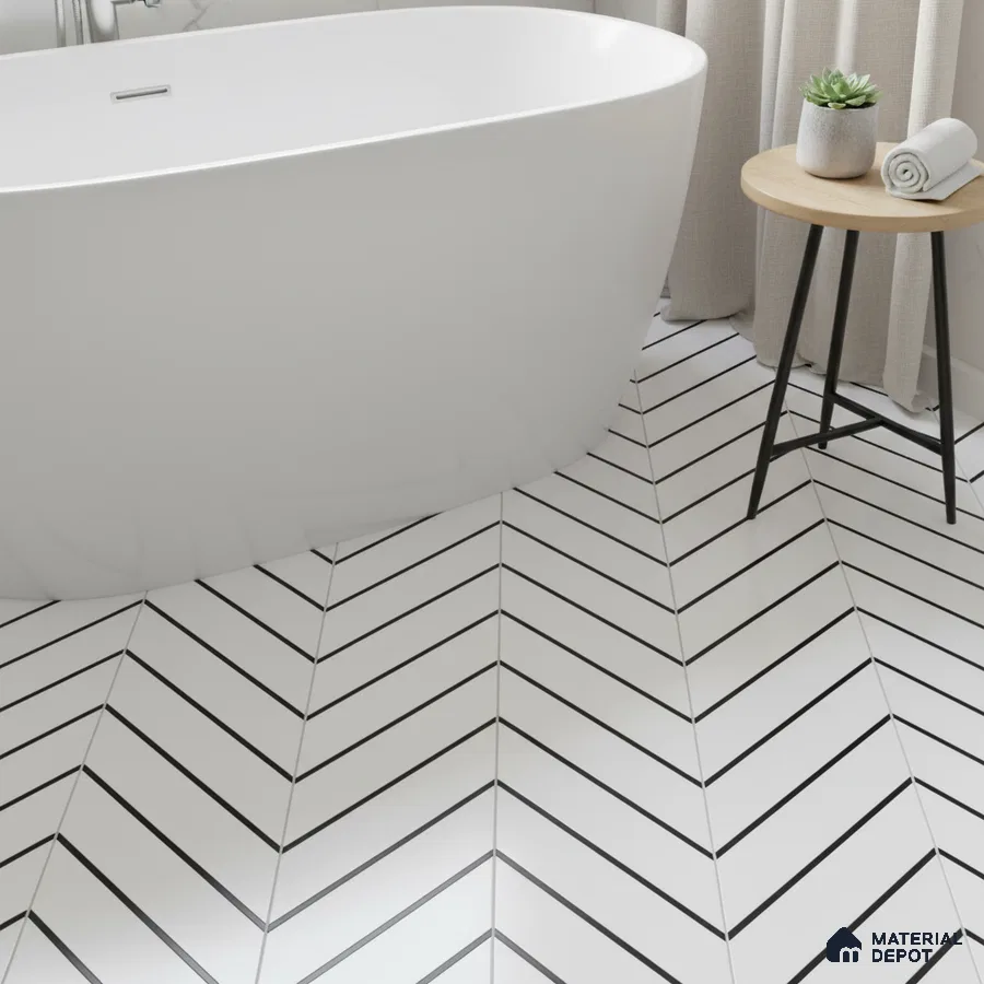 Minimalist bathroom with white chevron floor tiles and freestanding tub