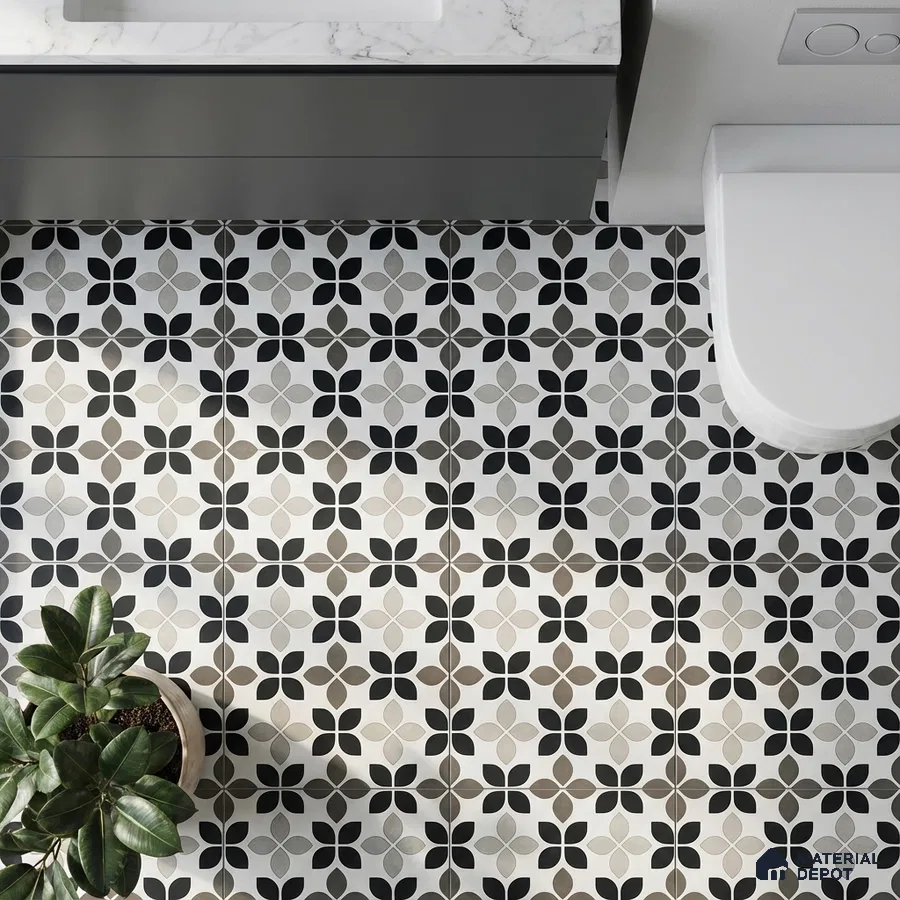 Modern bathroom with black-and-white floral geometric floor tiles and marble countertop