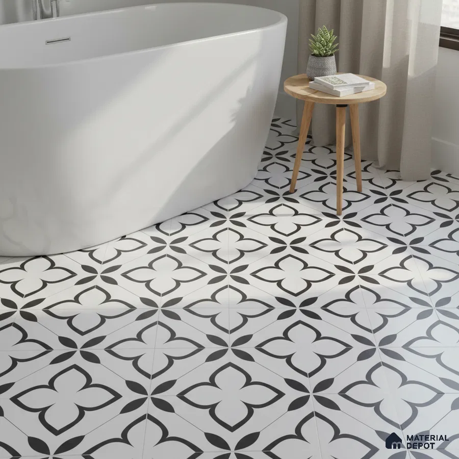 Modern bathroom with black-and-white floral patterned floor tiles and freestanding tub