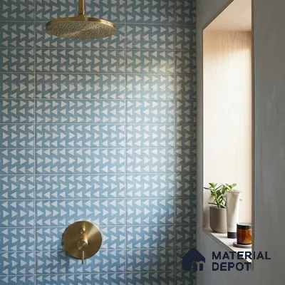 Mediterranean Bathroom with Cerulean Blue Patterned Tile and Brass Fixtures