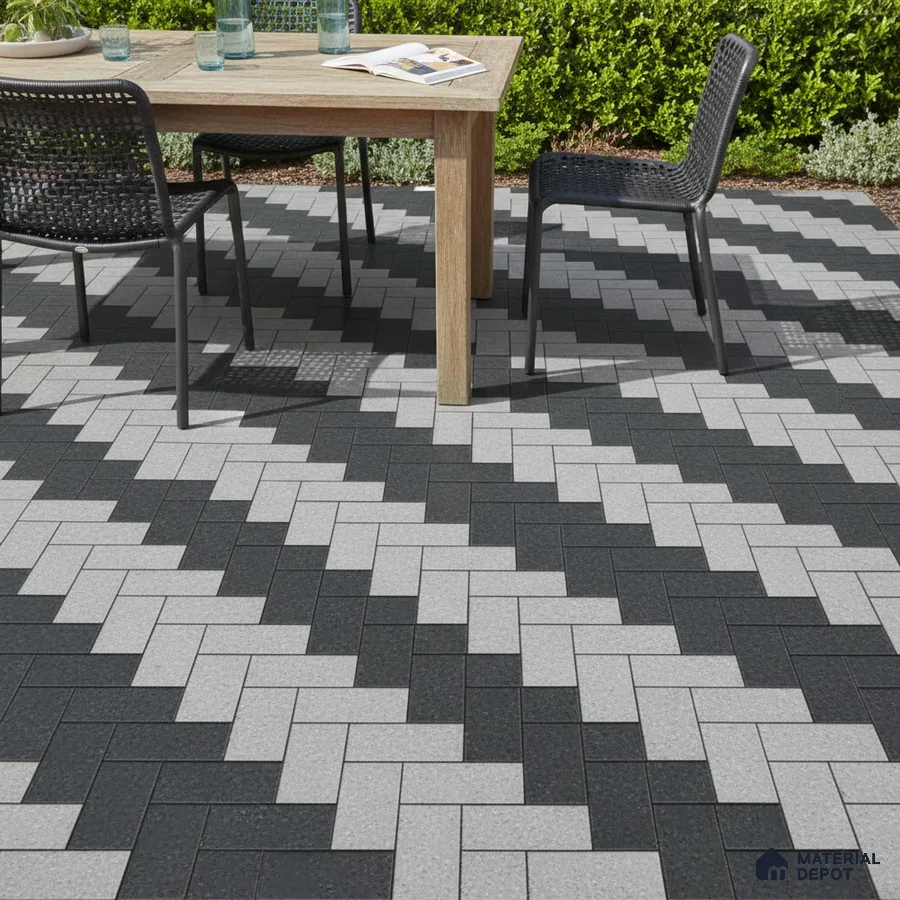 Modern outdoor patio with black and grey geometric floor tiles and wooden dining set