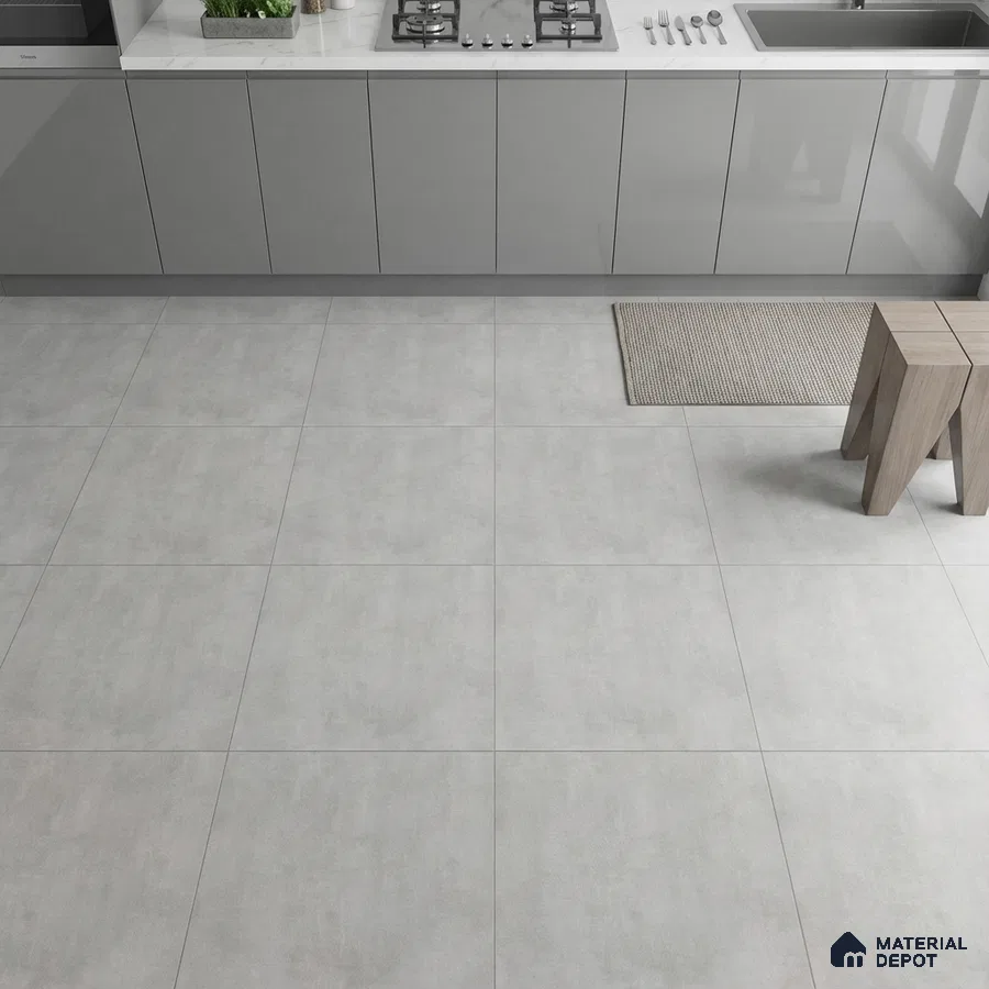 Modern kitchen with grey matte laminate cabinets and light grey stone-look floor tiles