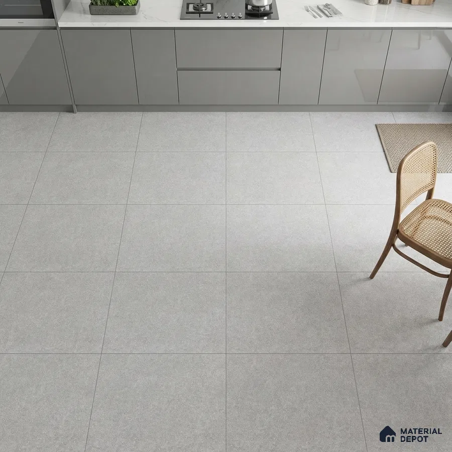 Modern kitchen with grey high gloss laminate cabinets, white marble-look quartz countertop, and light grey matte floor tiles
