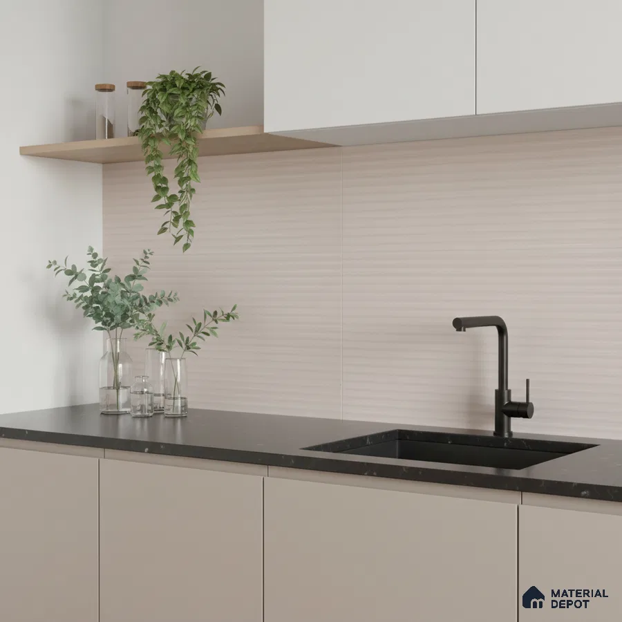 Minimalist kitchen with matte beige laminate cabinets, black quartz countertop, and subtle textured beige backsplash tile