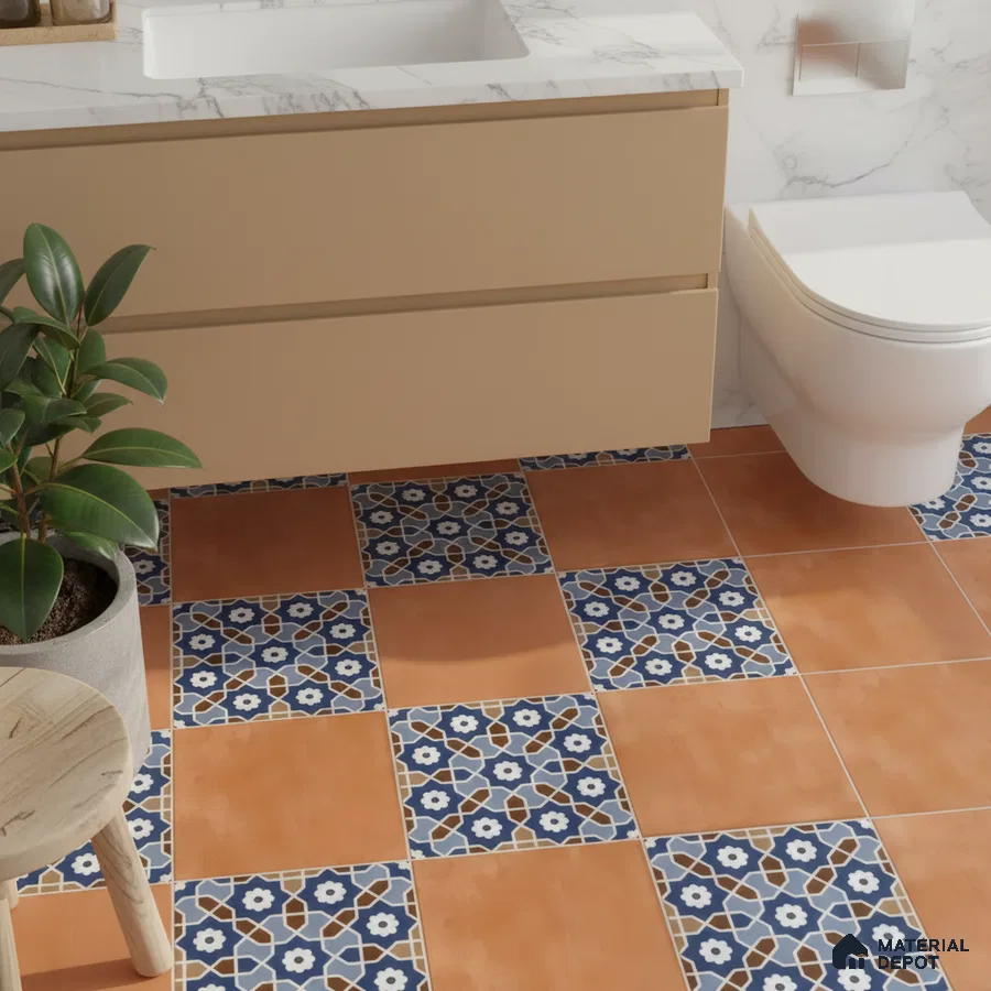 Mediterranean bathroom with terracotta and blue geometric patterned floor tiles and beige vanity