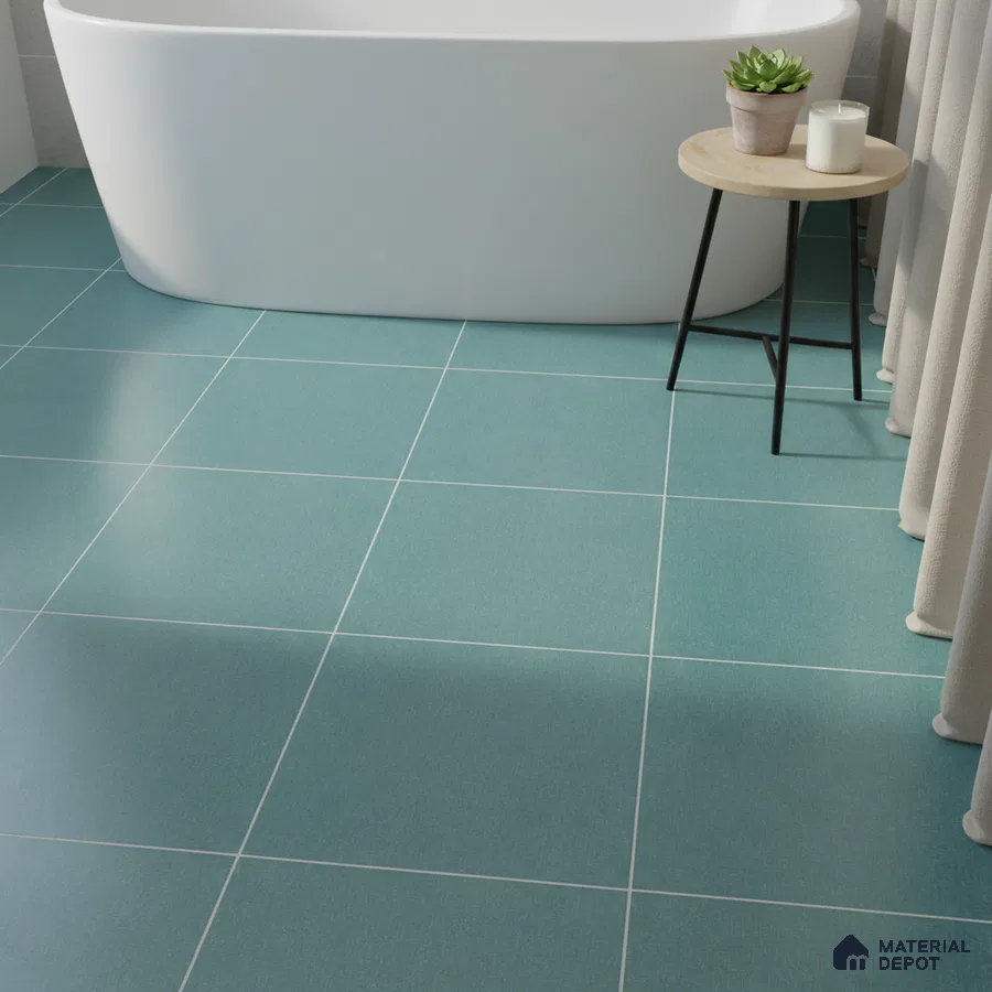 Minimalist bathroom with teal blue matte floor tiles and freestanding tub