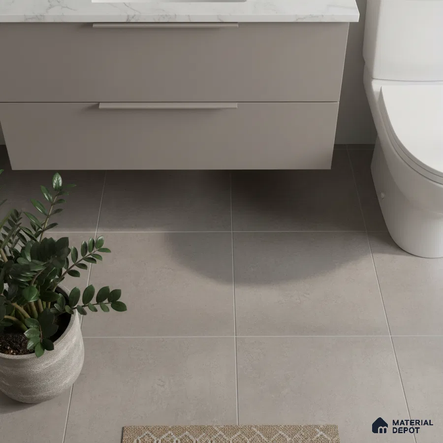 Minimalist bathroom with matte grey floor tiles and white marble-look countertop