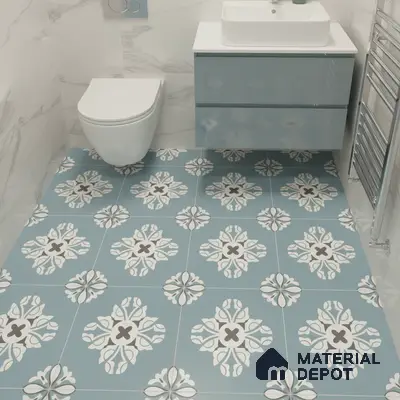 Modern bathroom with blue patterned floor tiles and marble-look wall tiles