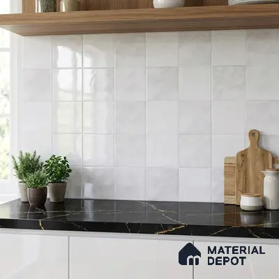 Modern kitchen with white square wall tiles, black marble-look countertop, and white gloss cabinets