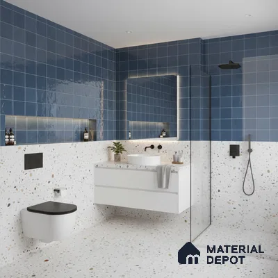 Modern kitchen with blue square wall tiles, blue laminate cabinets, and black marble countertop