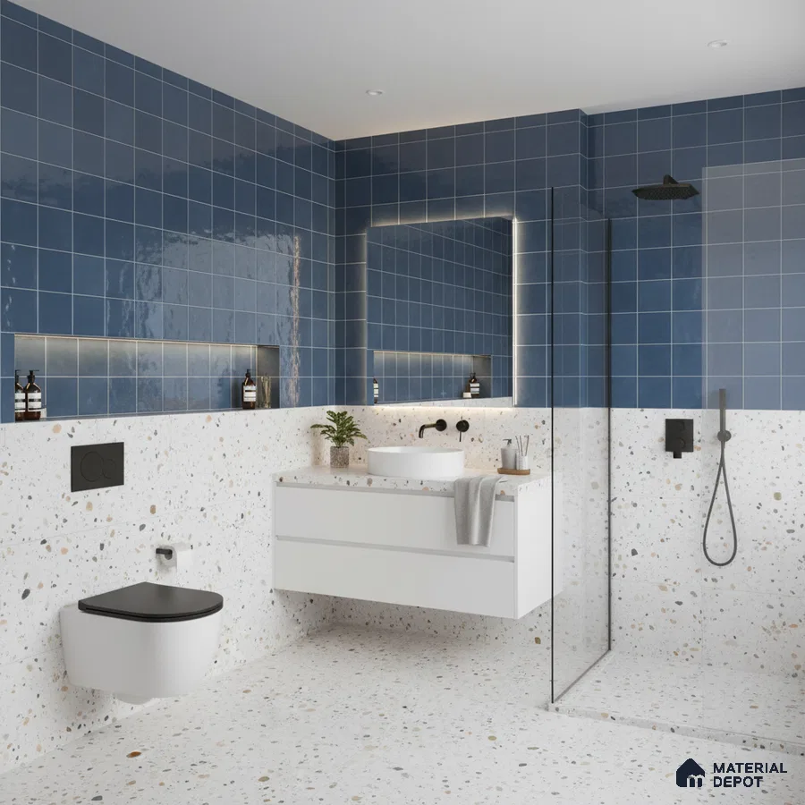 Modern kitchen with blue square wall tiles, blue laminate cabinets, and black marble countertop
