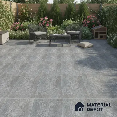 Modern outdoor patio with grey stone-look floor tiles and wicker furniture