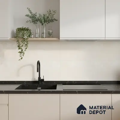 Minimalist kitchen with frosty white laminate cabinets, black marble countertop, and ivory marble-look backsplash tile