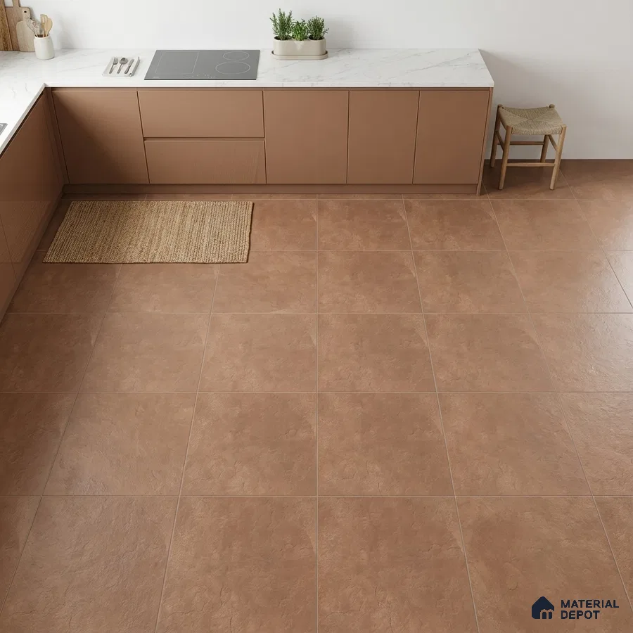 Modern kitchen with matte brown laminate cabinets, white marble-look countertop, and terracotta stone floor tiles