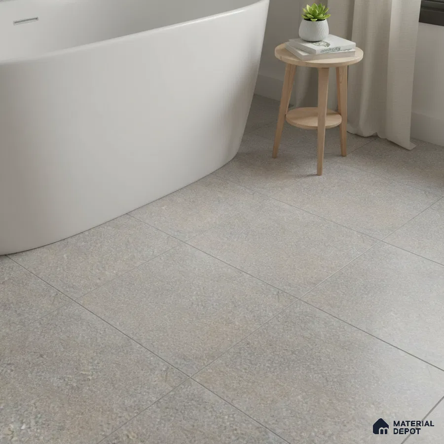 Minimalist bathroom with matte stone-look floor tiles and freestanding tub