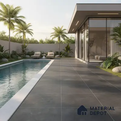 Modern outdoor poolside with large format grey stone tiles and minimalist landscaping