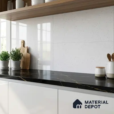 Modern kitchen with black marble countertop, white glossy cabinets, and white speckled wall tiles