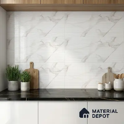Modern kitchen with ribbed marble-look wall tiles, black marble countertop, and white laminate cabinets