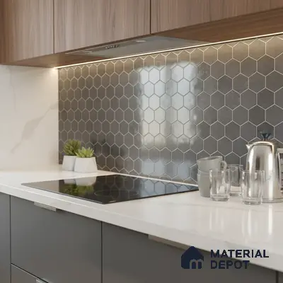 Modern kitchen with walnut laminate cabinets, grey hexagonal backsplash tile, and white marble countertop