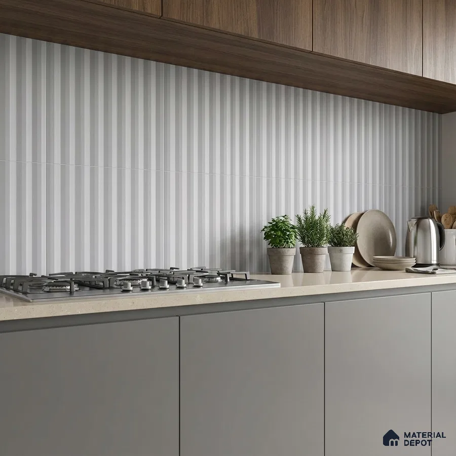 Modern kitchen with taupe quartz countertop, grey matte laminate cabinets, and vertical striped backsplash tile