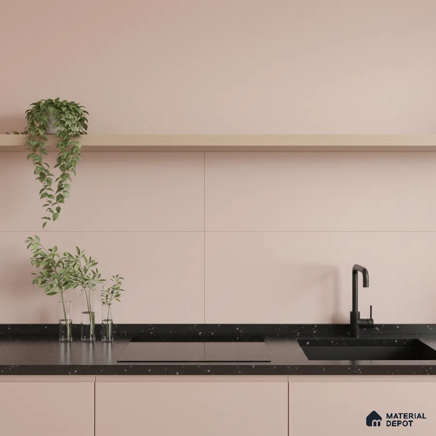 Minimalist kitchen with pastel pink laminate cabinets and black terrazzo countertop