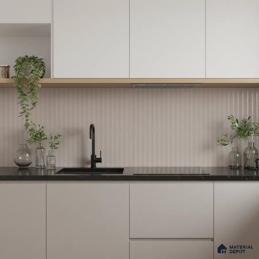 Minimalist kitchen with frosty white laminate cabinets, black quartz countertop, and beige fluted backsplash tile
