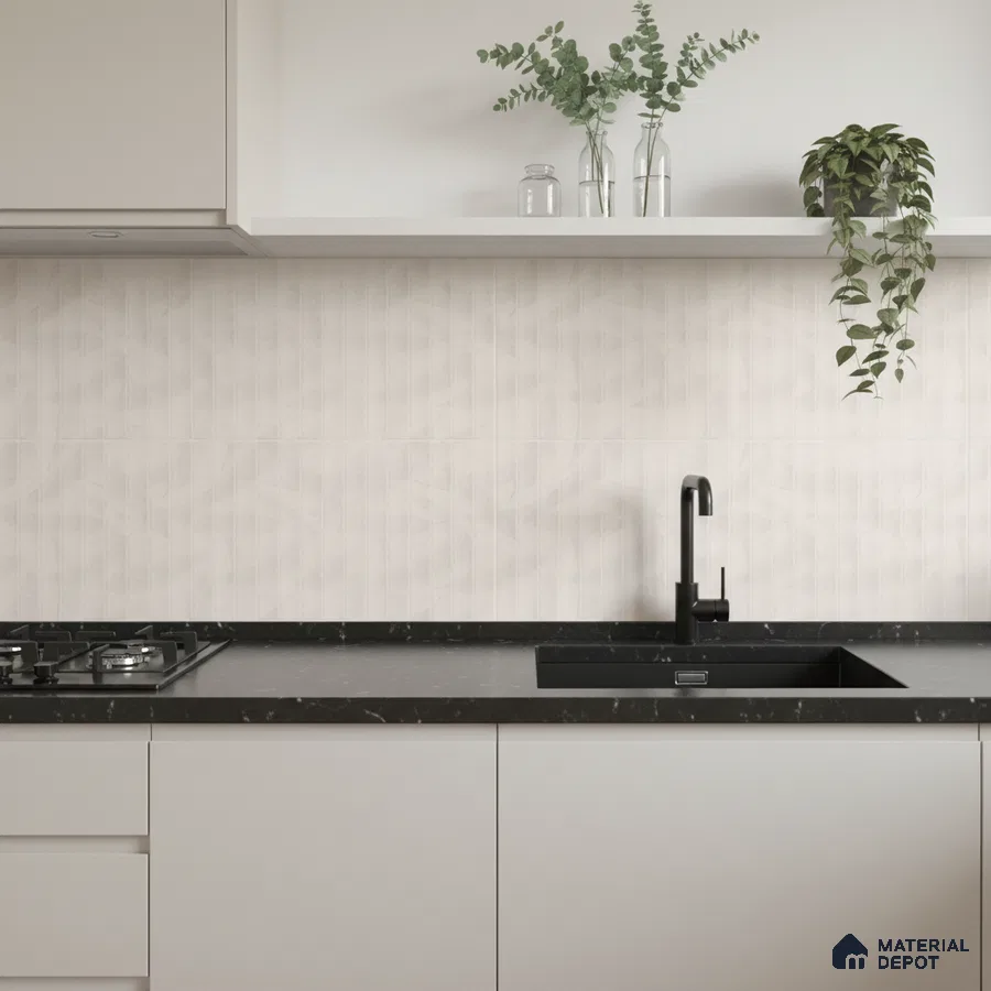 Minimalist kitchen with frosty white laminate cabinets, black marble countertop, and subtle geometric beige backsplash tile