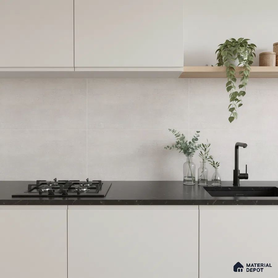 Minimalist kitchen with frosty white laminate cabinets, matte black quartz countertop, and light grey stone backsplash tile