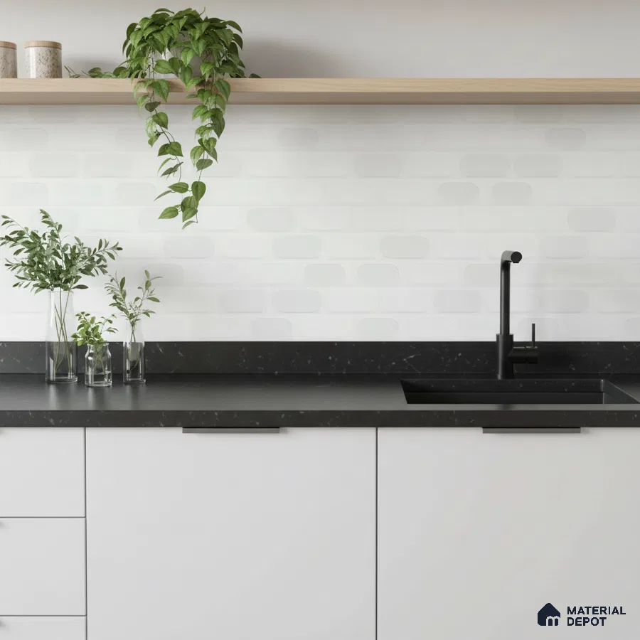 Minimalist kitchen with matte white laminate cabinets, black quartz countertop, and white subway backsplash tile