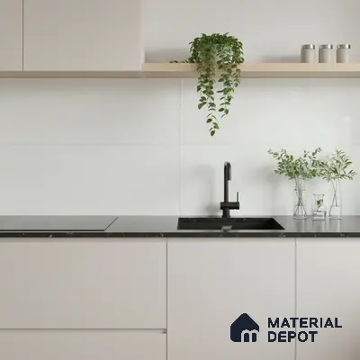 Minimalist kitchen with matte white laminate cabinets and black marble countertop
