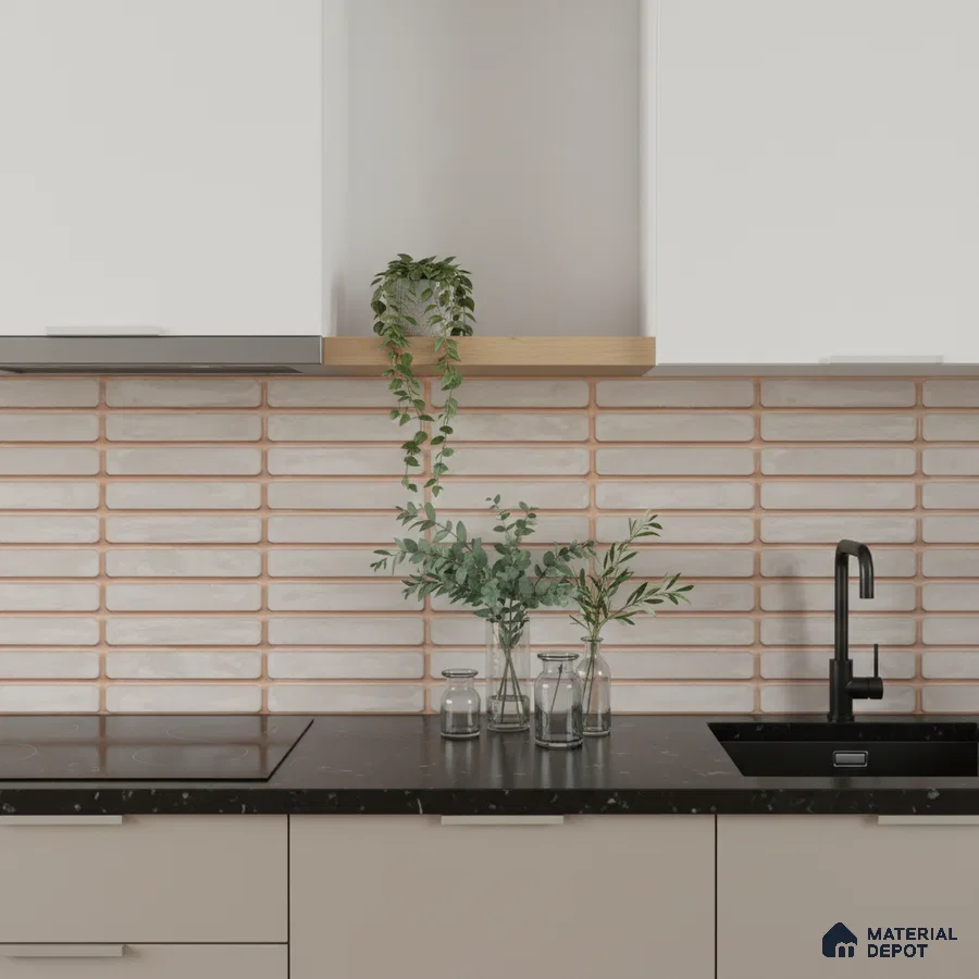 Scandinavian kitchen with beige cabinets, black quartz countertop, and blush kitkat subway backsplash tile