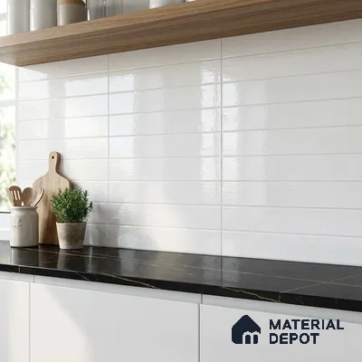 Modern kitchen with glossy white subway wall tiles, black marble countertop, and white laminate cabinets