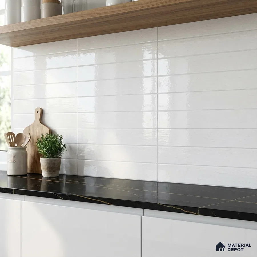 Modern kitchen with glossy white subway wall tiles, black marble countertop, and white laminate cabinets