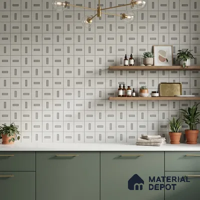 Scandinavian kitchen with sage green laminate cabinets, geometric patterned wall tiles, and white quartz countertop