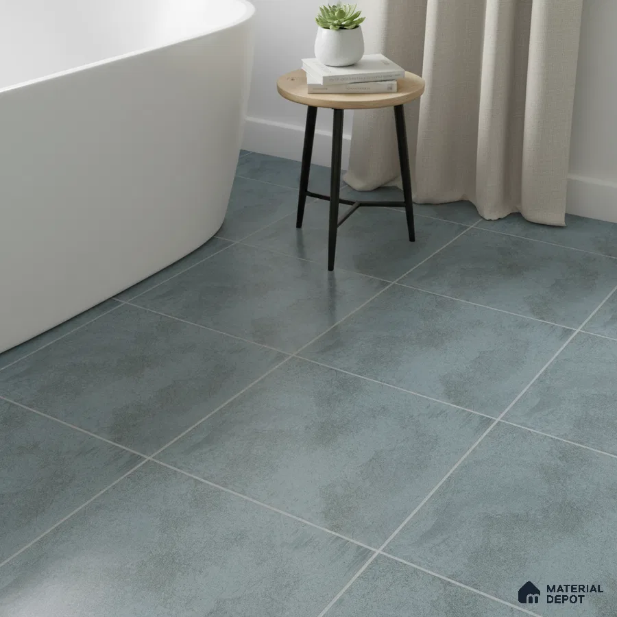 Minimalist bathroom with matte blue-grey floor tiles and freestanding tub