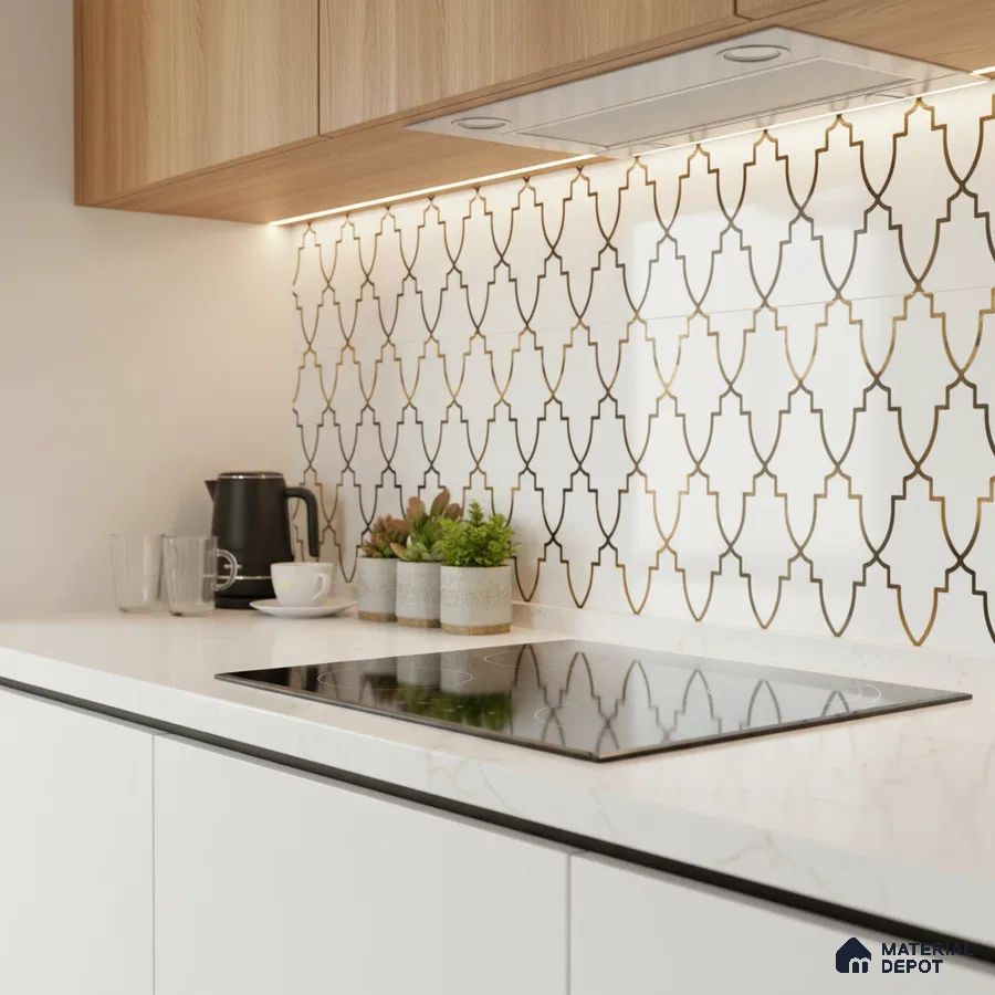 Modern kitchen with white quartz countertop, gold geometric backsplash tile, and light oak laminate cabinets