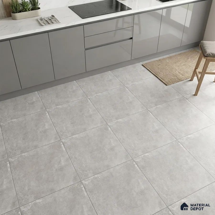Modern kitchen with grey high gloss laminate cabinets, white marble-look countertop, and light grey stone floor tiles