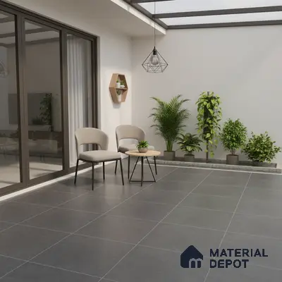 Modern balcony with charcoal grey floor tiles and minimalist outdoor seating